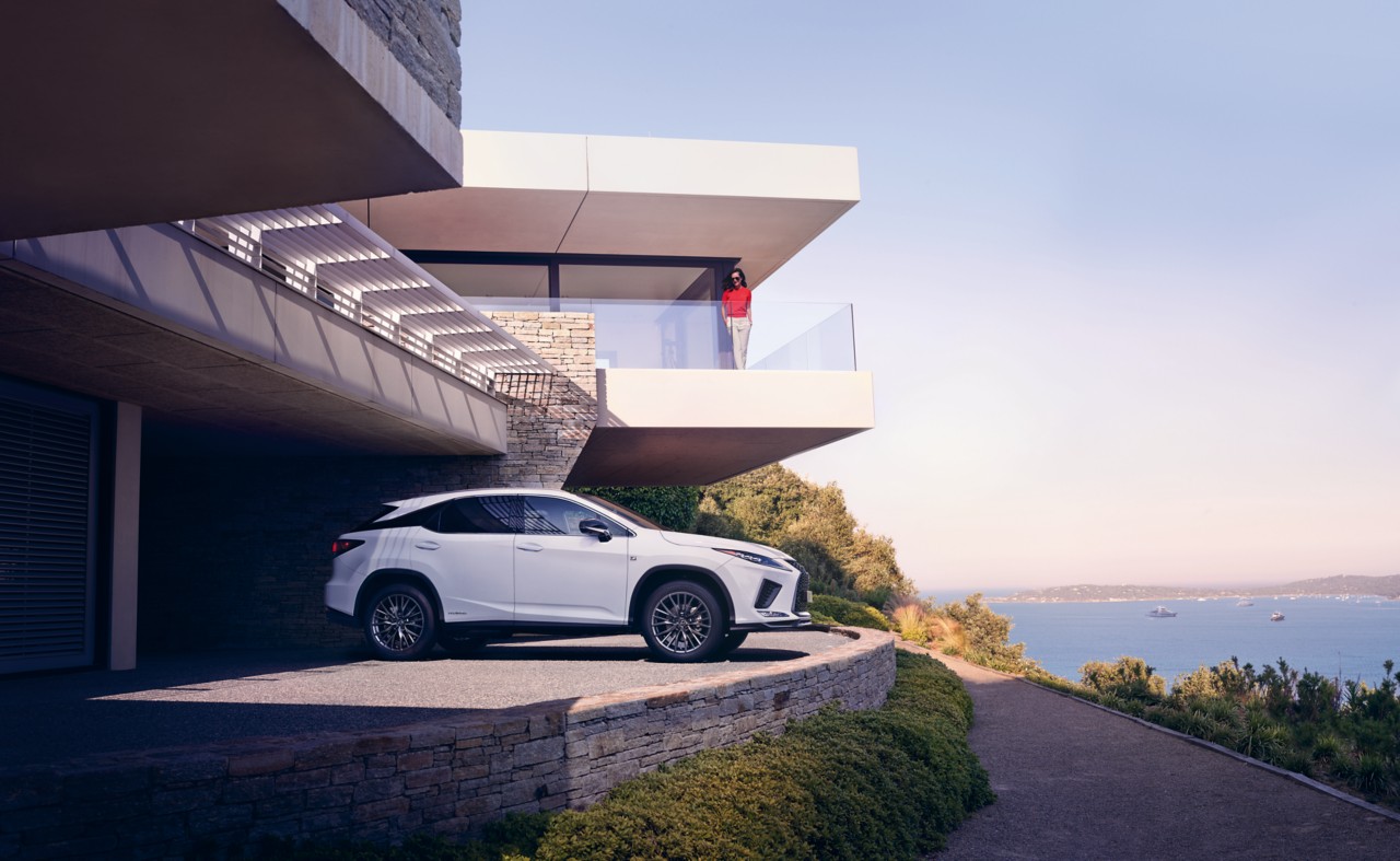 A Lexus parked outside a coastal home