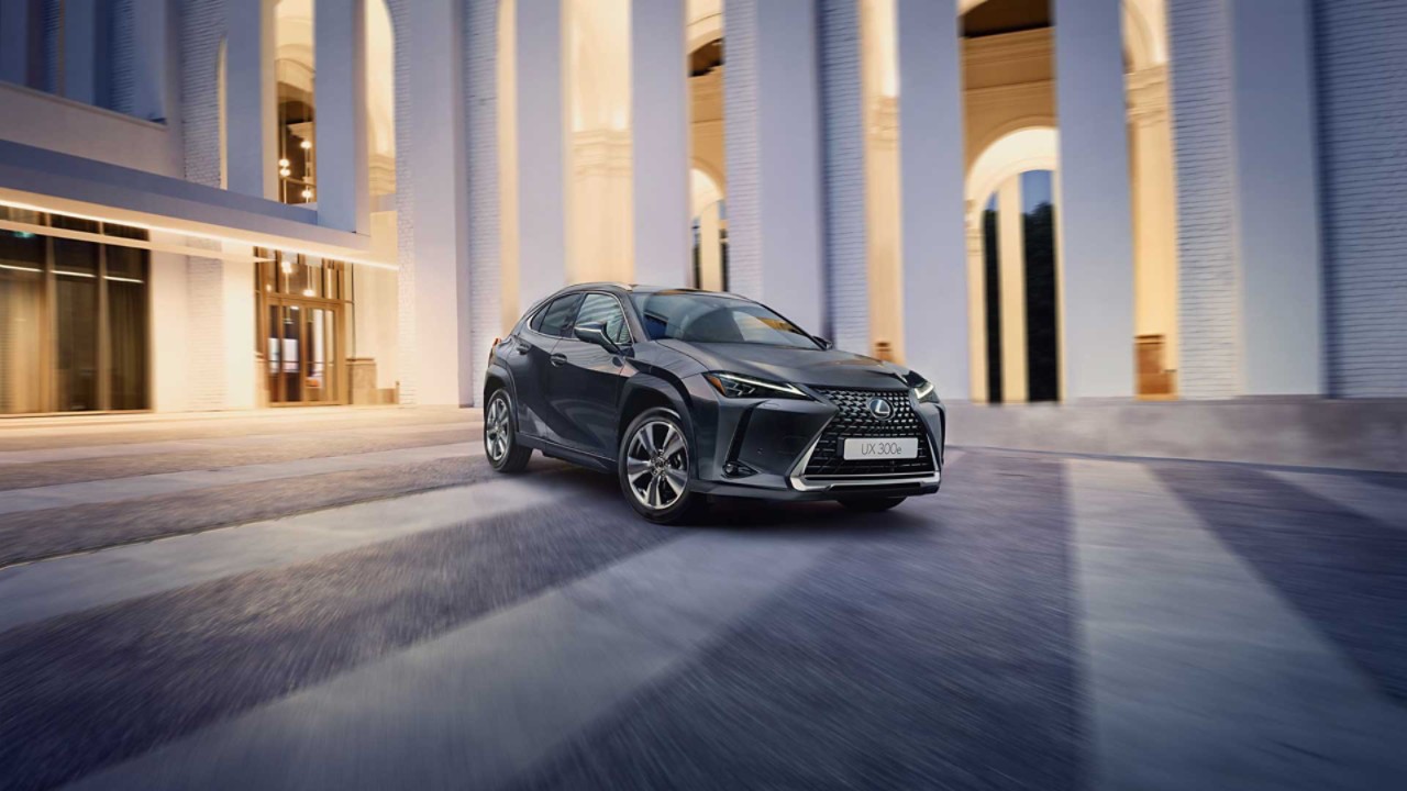 Lexus UX 300e plugged into a charging tower