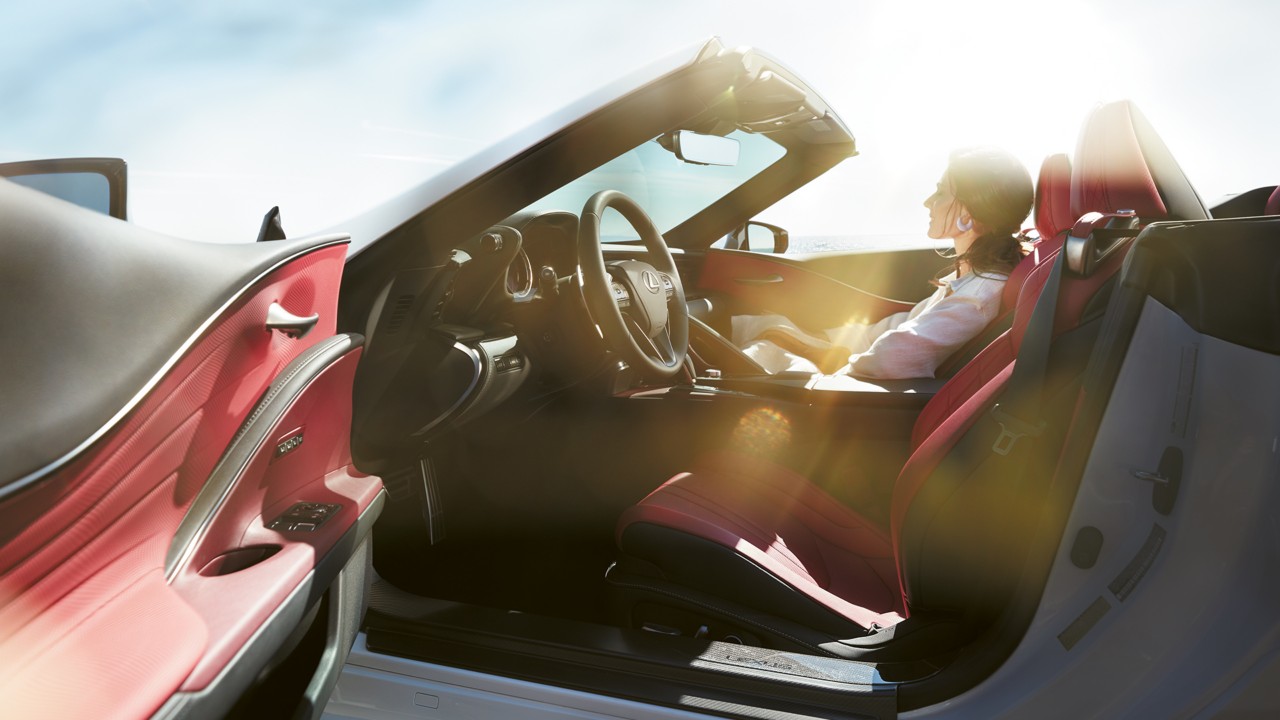 A woman sat in the Lexus LC Convertible