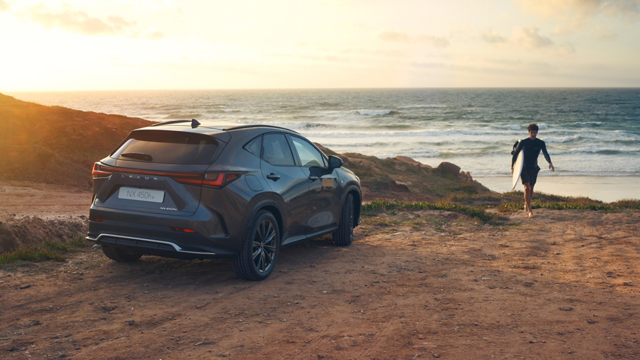 A Lexus NX parked on a coastline 