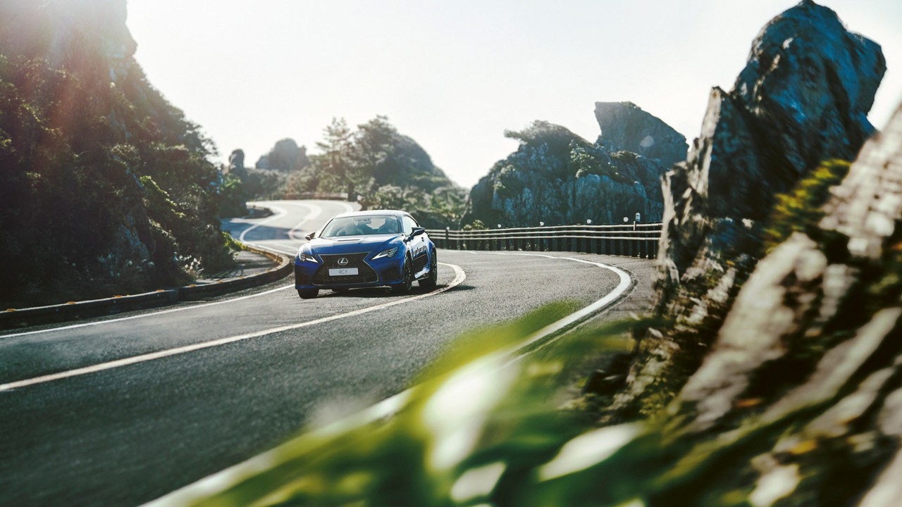 Lexus RC F driving on a mountain road