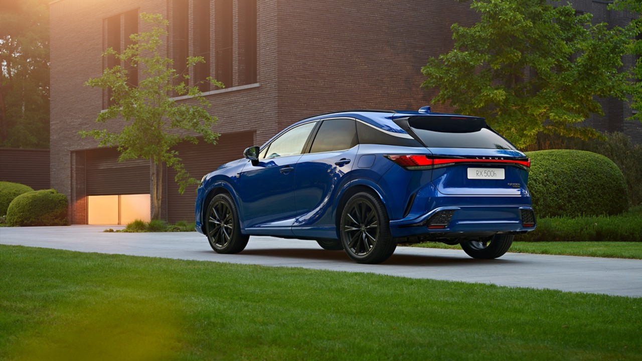 A Lexus RX 500h parked outside a building