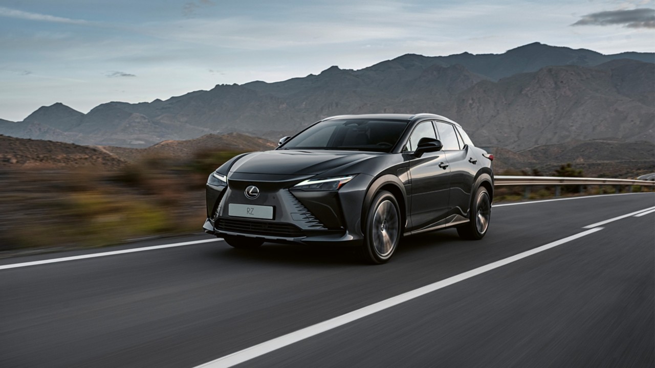 Lexus RZ driving in a rural location 