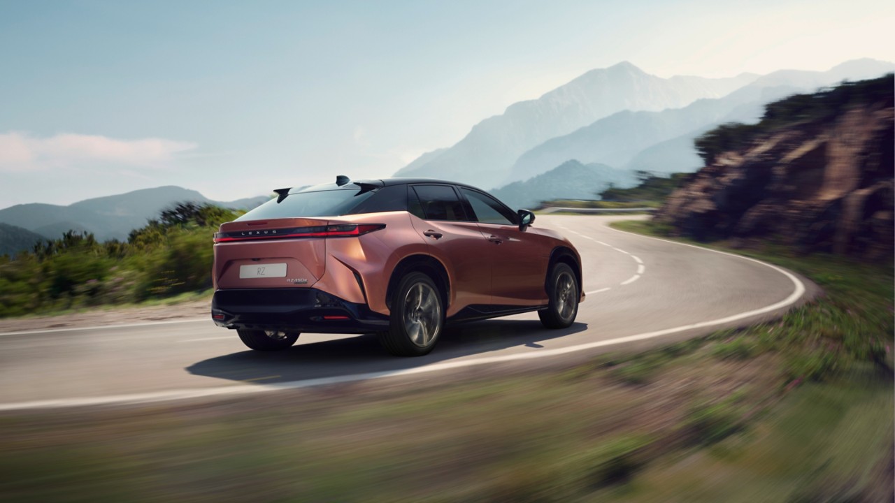 Lexus RZ 450e driving in a mountainous location