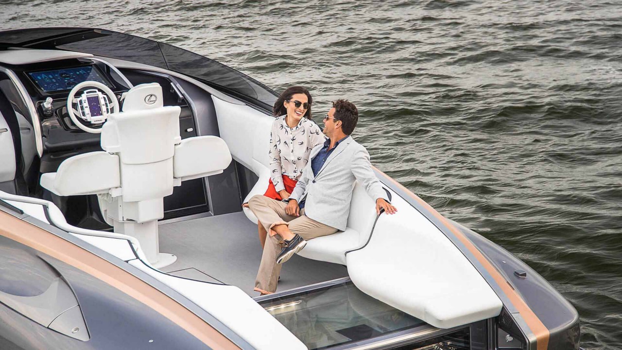 A man and woman sat on the Lexus Sports Yacht 