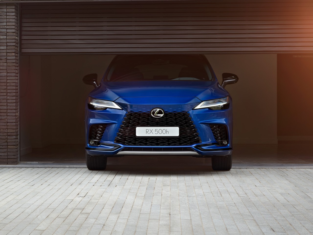 A Lexus RX parked in a garage opening