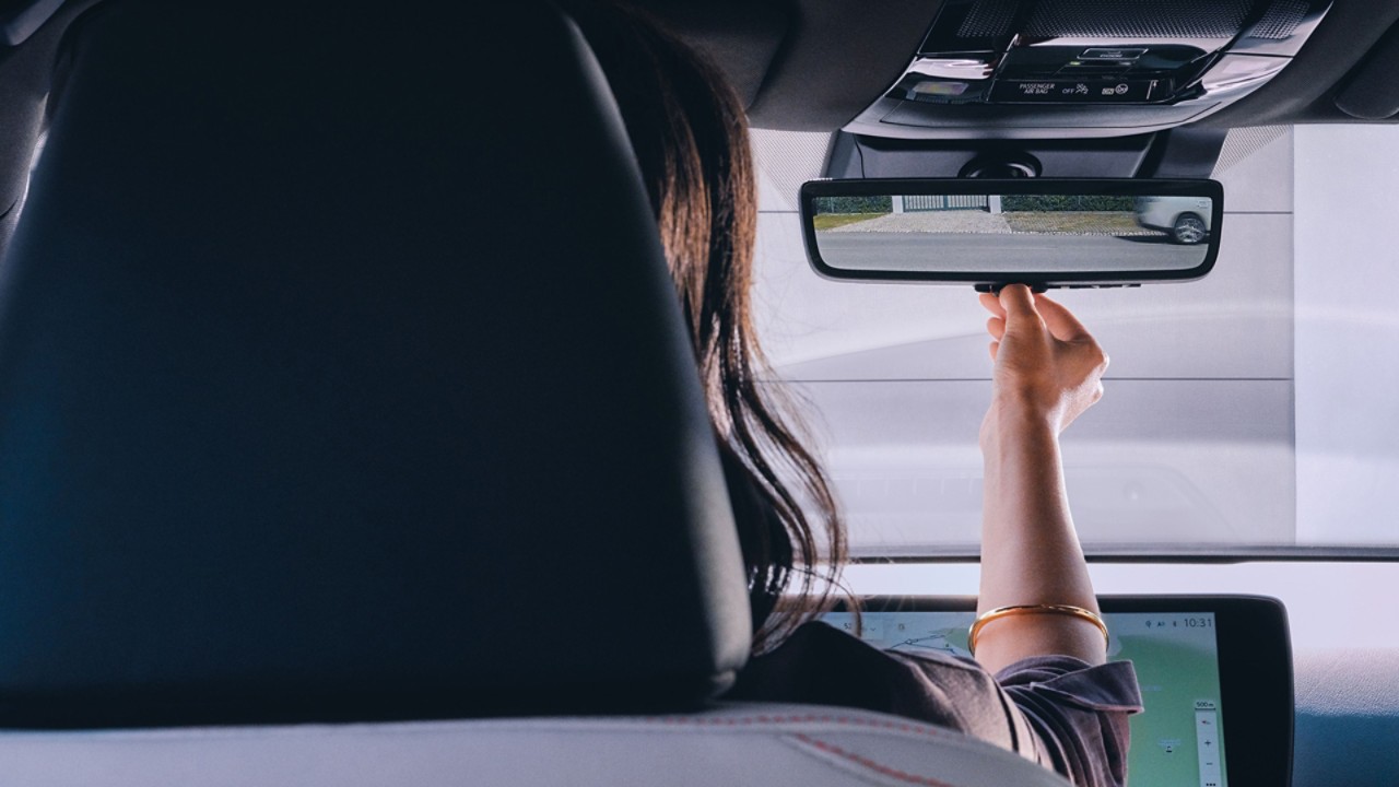 A woman using the Lexus NX's digital mirror