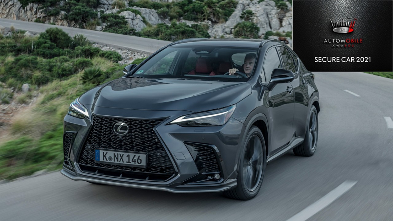 A Lexus NX 450h+ driving on a road