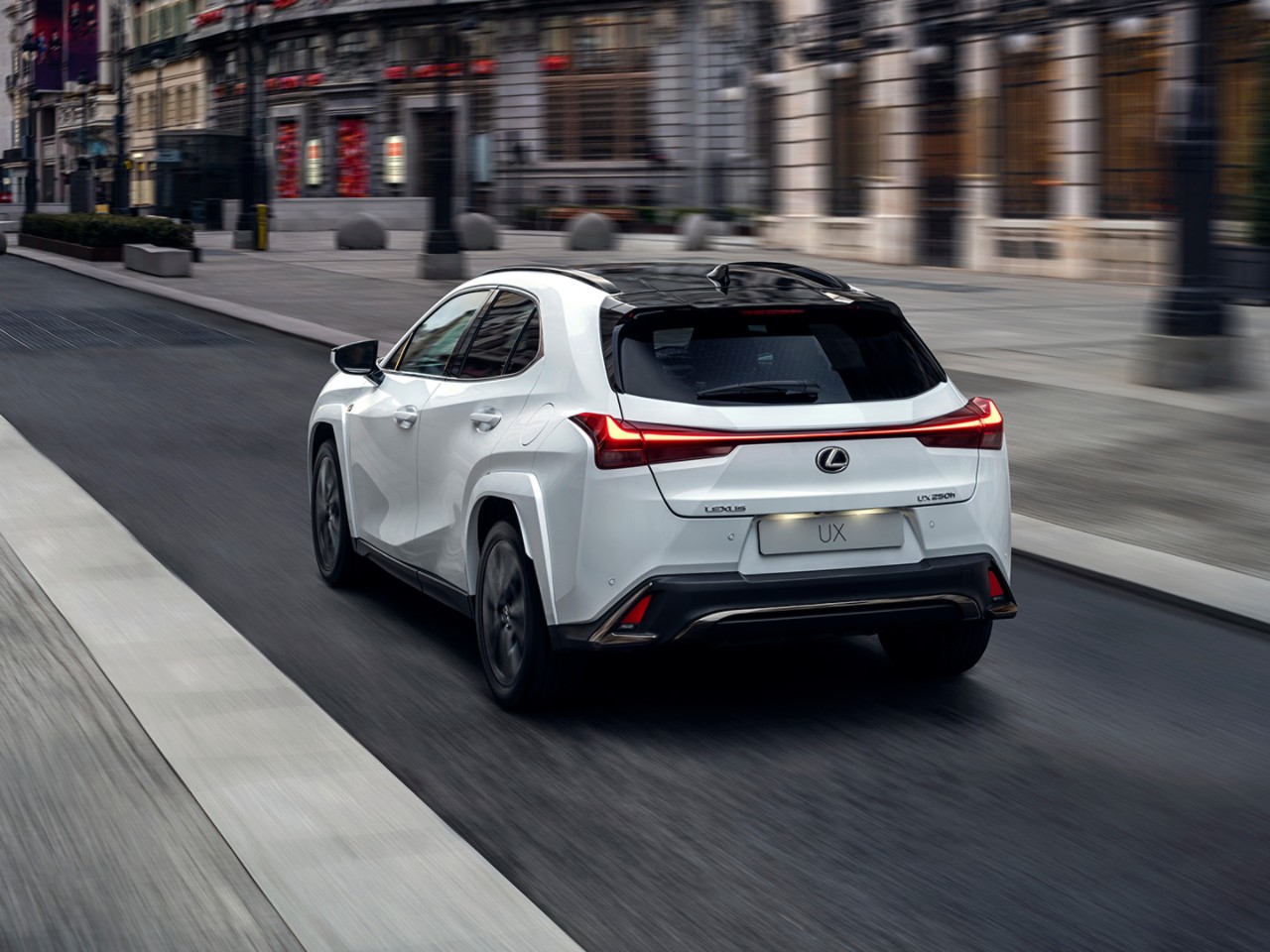 Lexus UX driving in a town location 