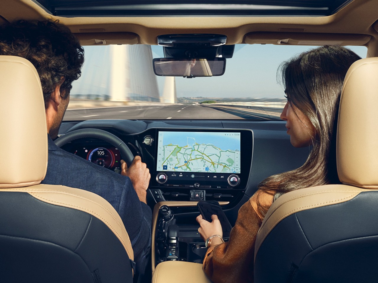A man and woman sat in a Lexus