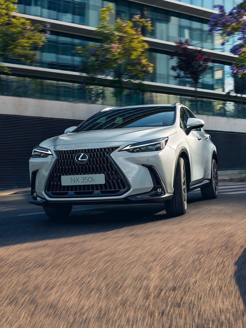 A Lexus NX driving around a corner